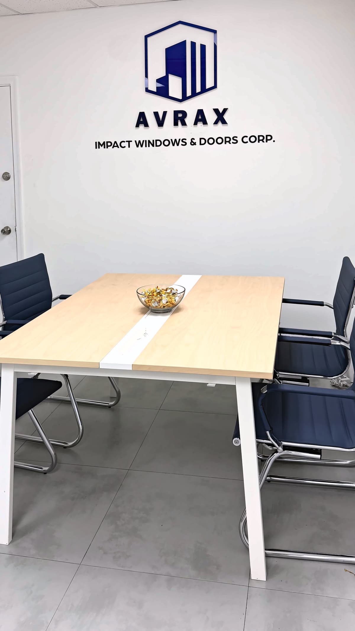 Avrax office conference room with the Avrax logo on the wall